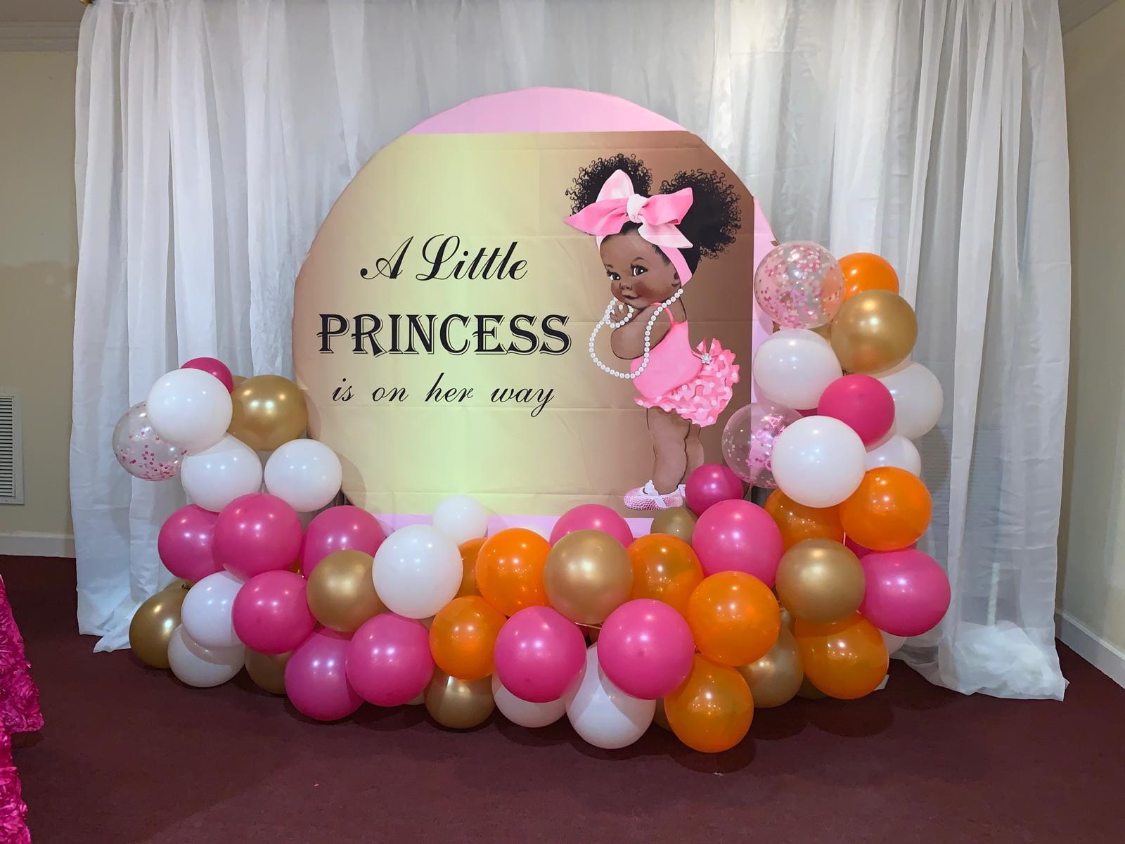 Baby shower backdrop with balloon garland in the banquet hall.