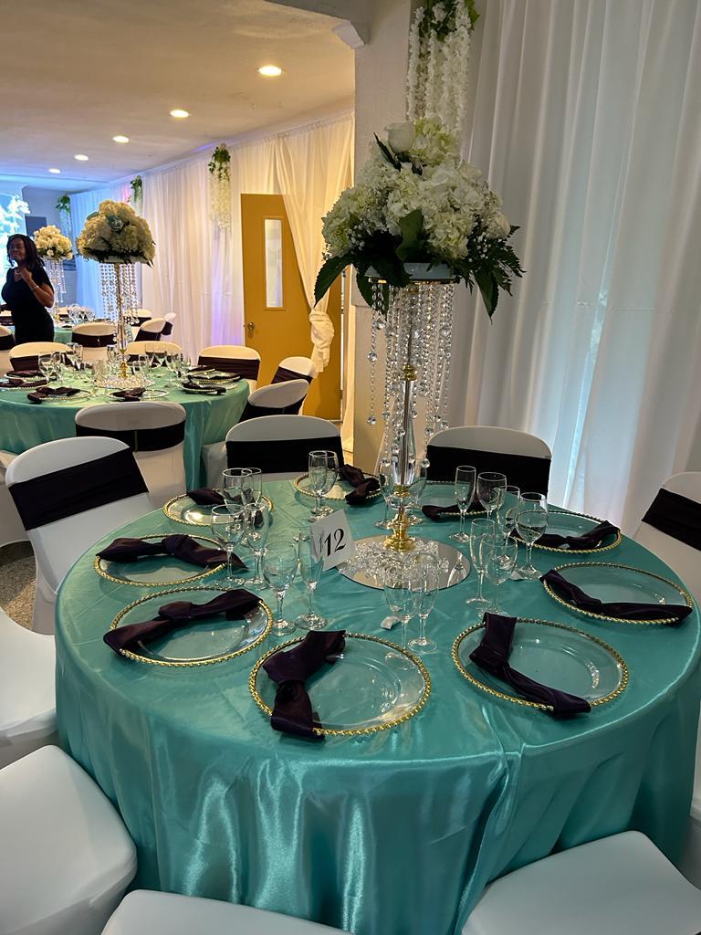 Banquet hall interior with event décor and seating.