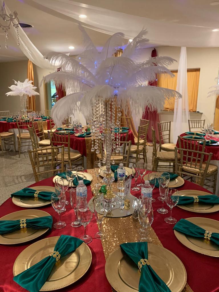 Banquet hall set for a reception with tables and chairs.