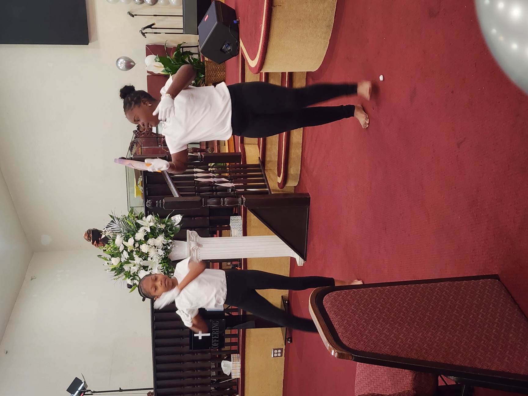 Children's Ministry mime and dance team performing on stage.