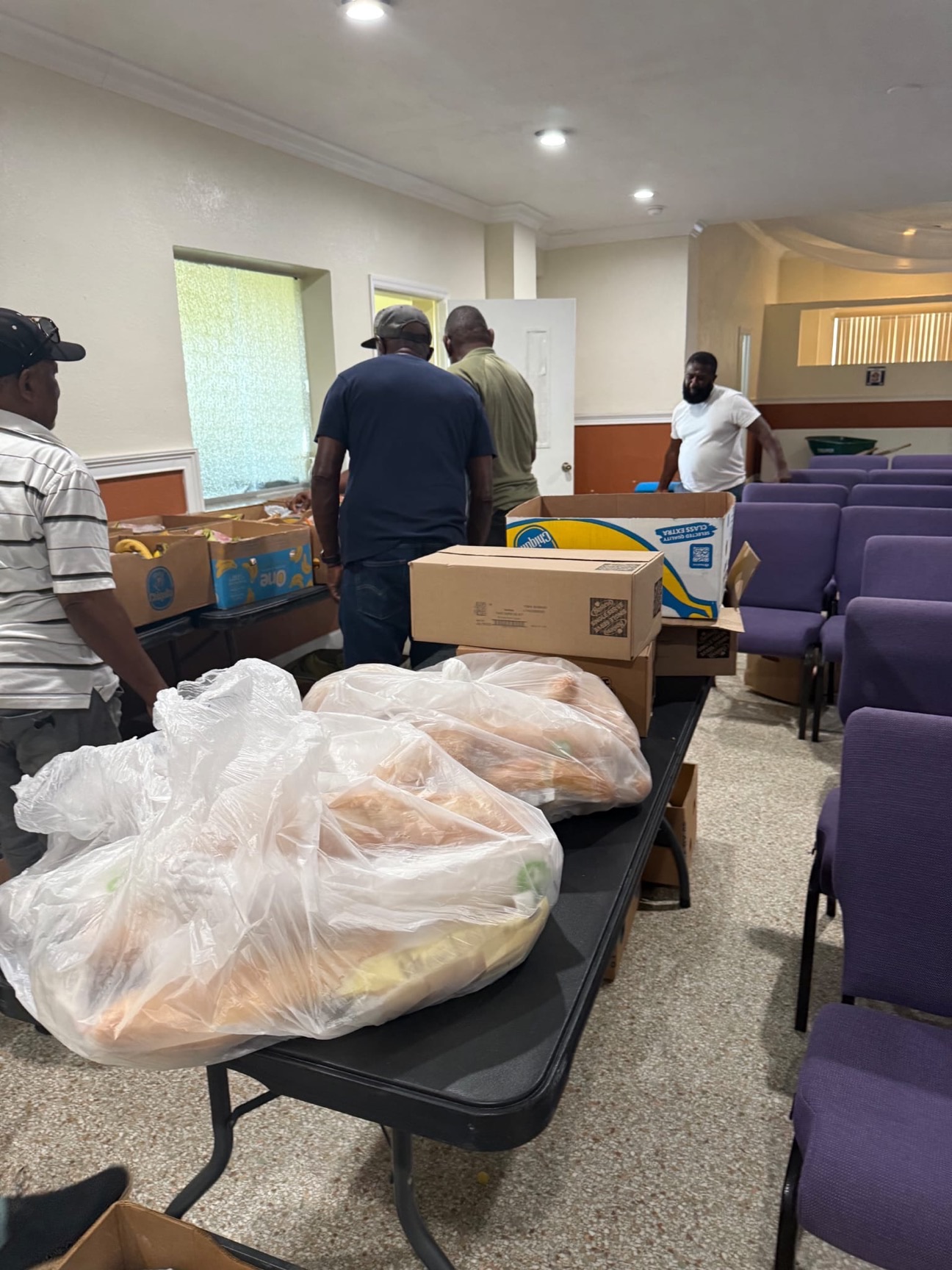 Stacked meal boxes ready for the Food Distribution Ministry outreach.
