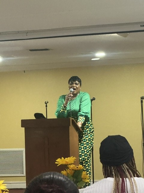 A speaker at the podium during the Know Your Neighbor Prayer Breakfast.