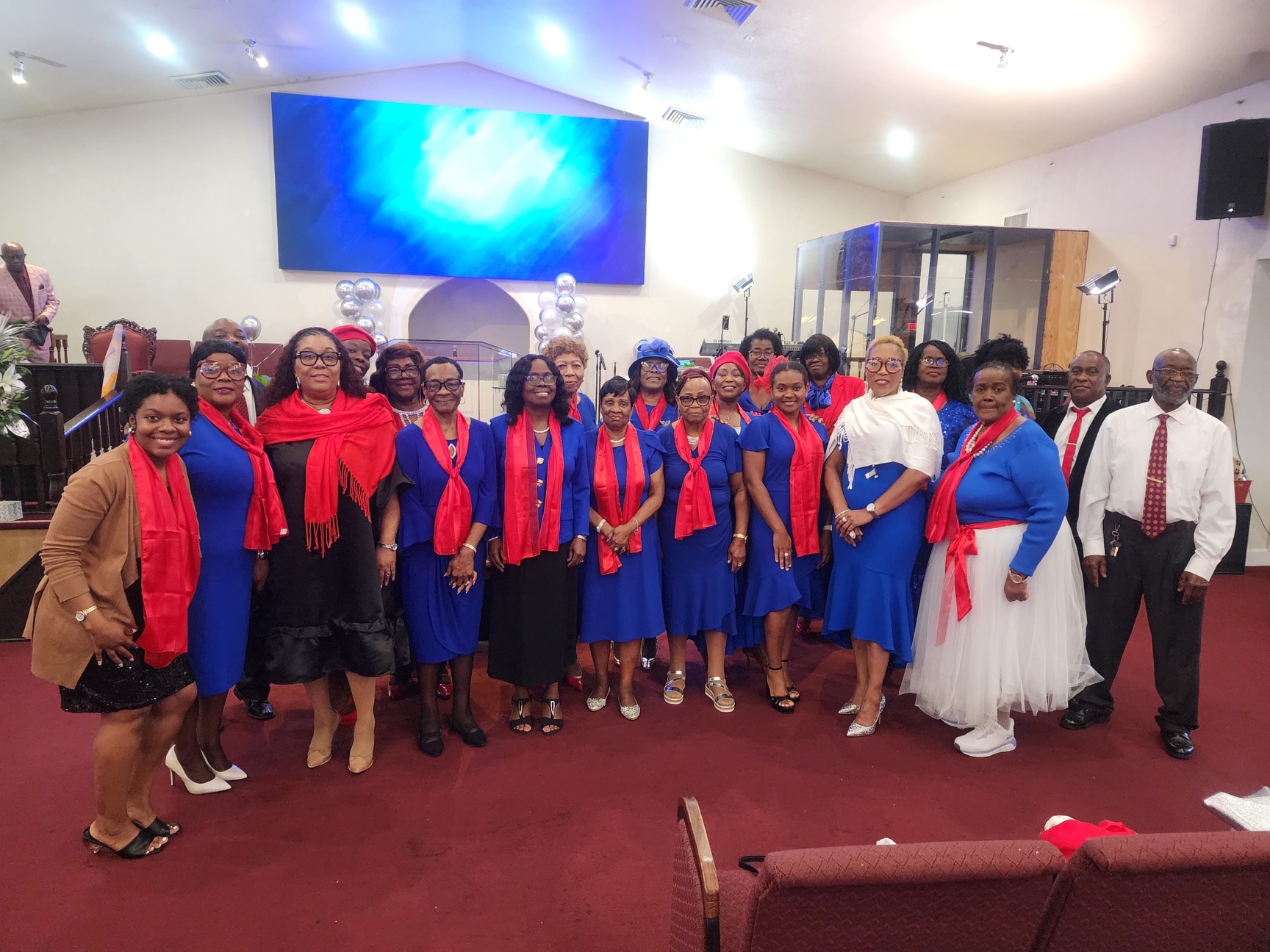 NLWC Choir in purple and red robes — full group photo.